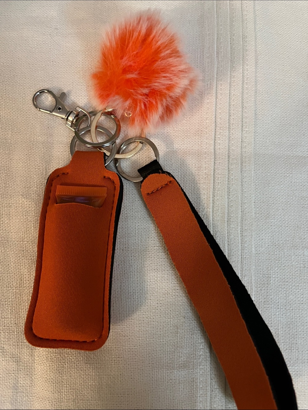 Orange Pom-Pom Keychain & Lip Balm Holder with Wrist Strap